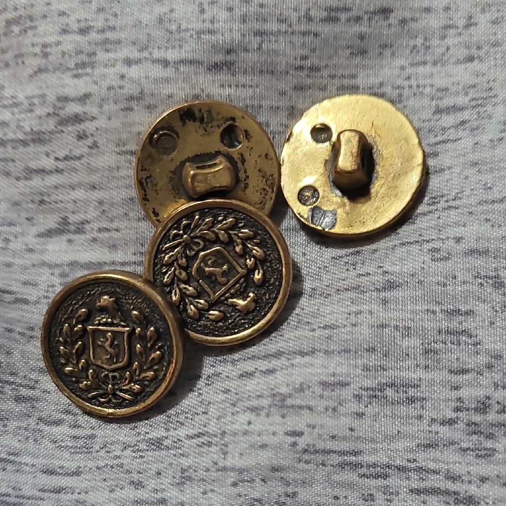 Vintage gold brass tone crest leaves symbol plastic button mid century